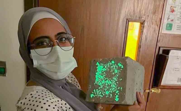 AUC Student Holding Glow-in-the-Dark Concrete