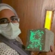 AUC Student Holding Glow-in-the-Dark Concrete