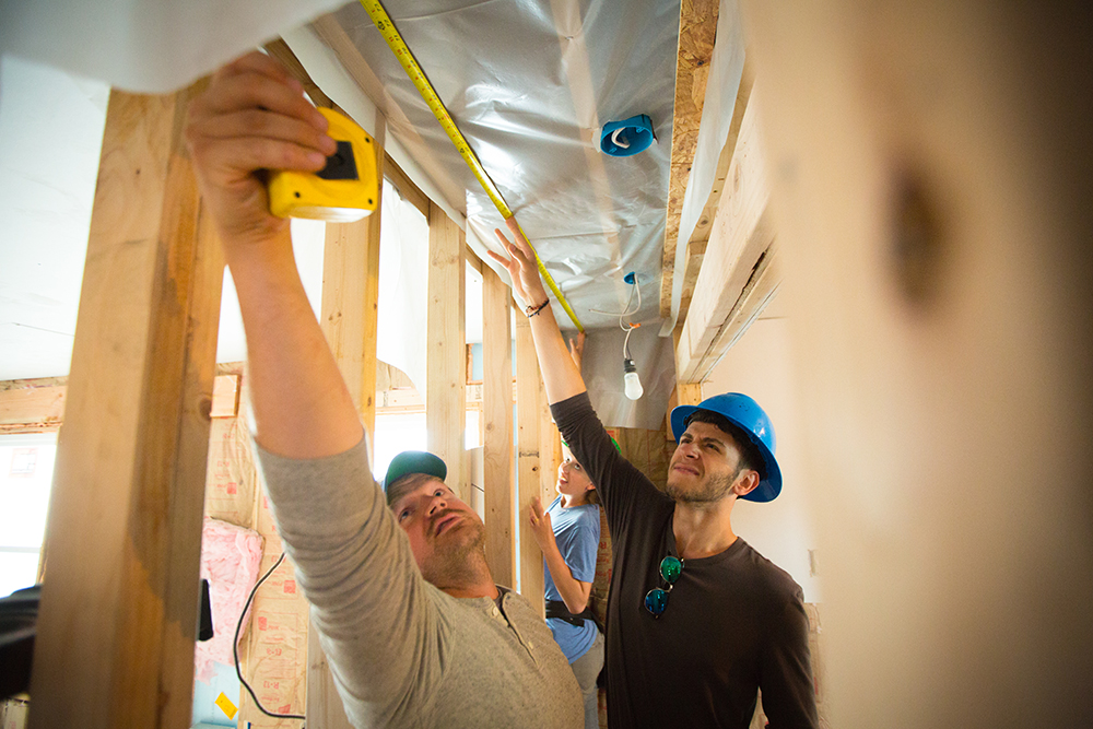 University at Buffalo students work on the interior of a Habitat for Humanity house on Buffalo's East Side.